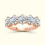 Rose gold ring featuring five hexagonal-cut diamonds set in a vintage design.