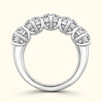 Silver band ring adorned with five sparkling diamonds in a prong setting.