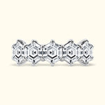 Elegant silver ring featuring hexagonal diamond patterns in a polished finish.