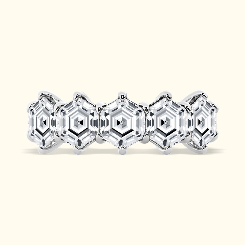 Elegant silver ring featuring hexagonal diamond patterns in a polished finish.