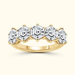 Gold ring featuring five hexagon-shaped clear stones set in a pronged design.