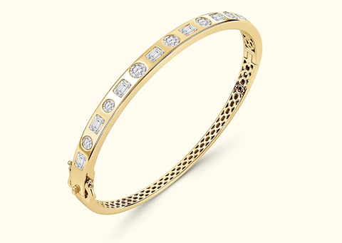 Yellow gold bangle with mixed-shape diamonds