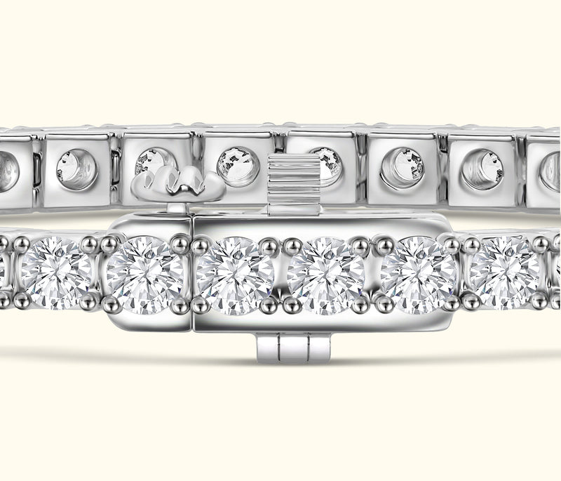 Silver bracelet with multiple sparkling diamonds set in a linked design.